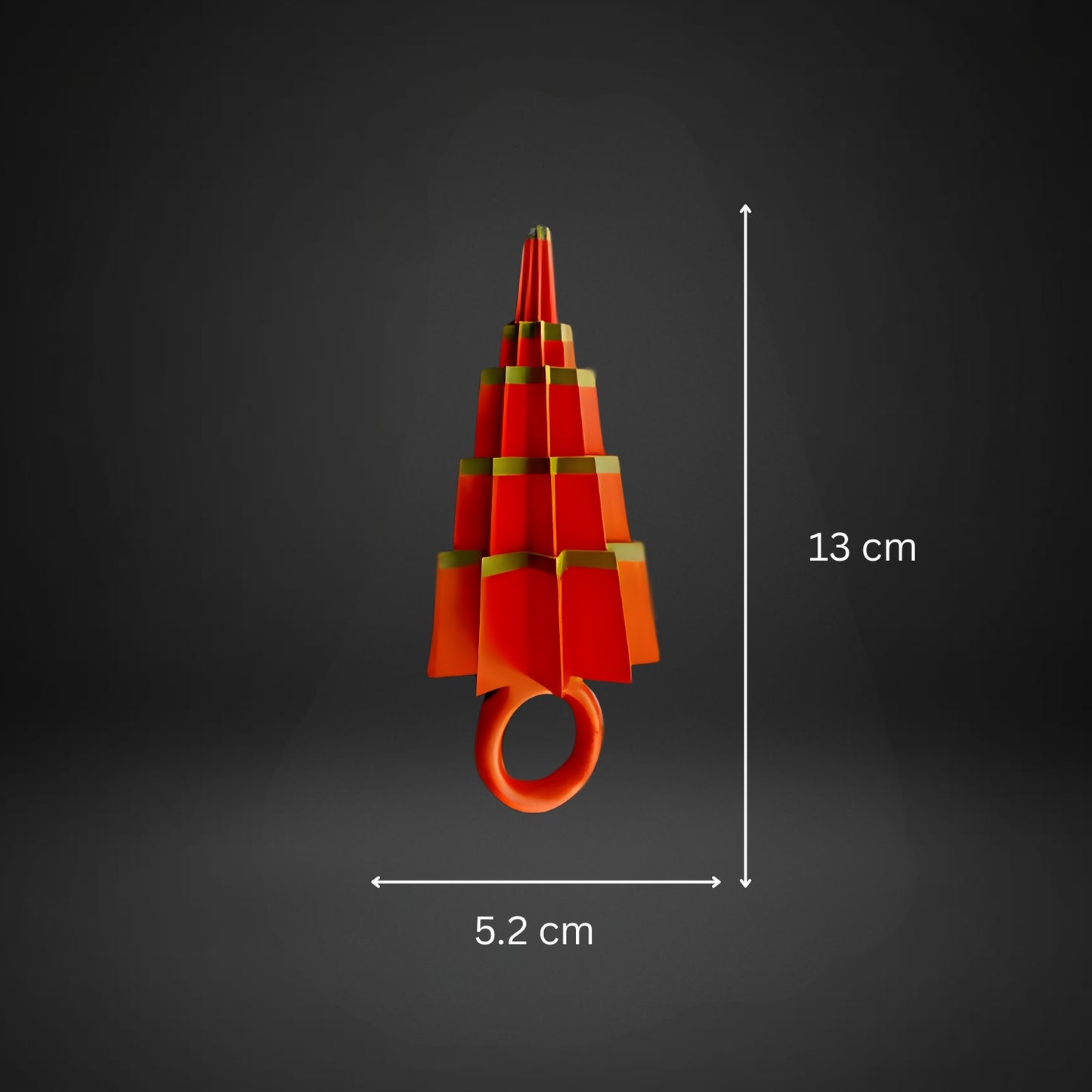 Red and gold decorative item with measurements on a dark background